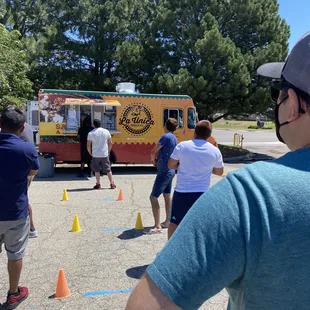 Food truck line COVID approved 6ft apart.