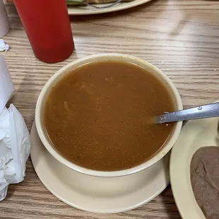a bowl of soup and a sandwich