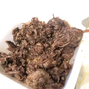 a close up of a bowl of meat