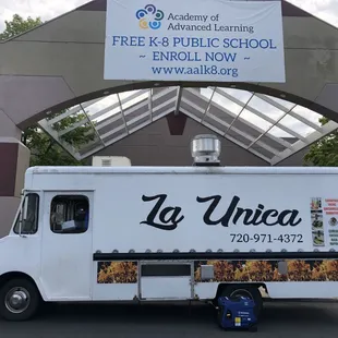 a food truck parked in front of a building