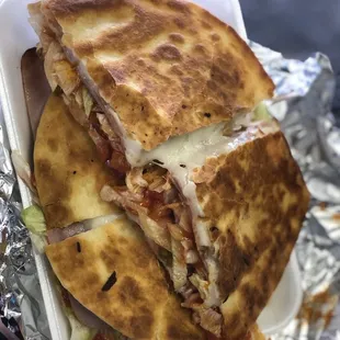 a chicken and cheese quesadilla sandwich
