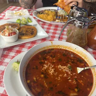 Birria ramen delicious!! Also pictured papusas and birria taco plate