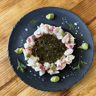 a plate of food on a wooden table
