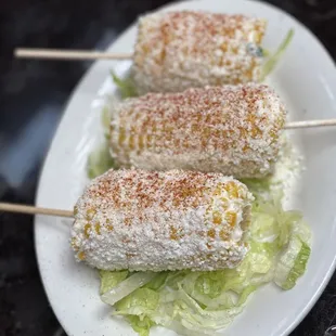 corn on a stick with lettuce