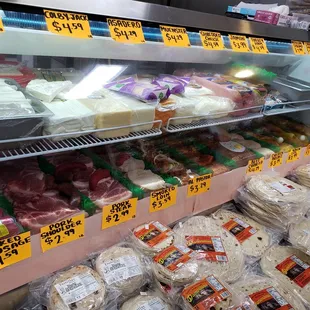 a display of meat and cheeses