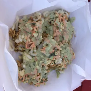 Tostones (patacones) chicken and salad with sauce.