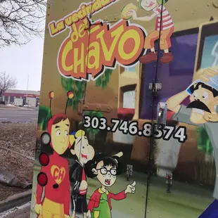 a cartoon character on the side of a food truck