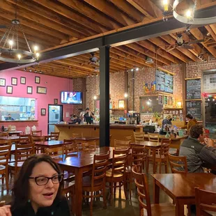 people sitting at tables in a restaurant