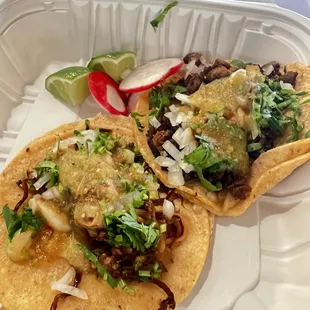 1 carnitas taco, 1 carne asada taco