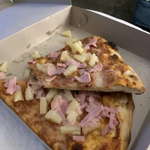 Old cheese slices with toppings just slapped on