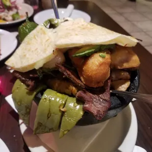 Molcajete. Also comes with beans, rice and tortillas, huge.