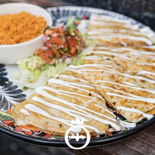 a plate of quesadillas and a bowl of rice