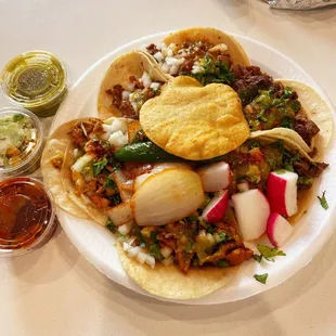 Chicken, steak, and al pastor tacos