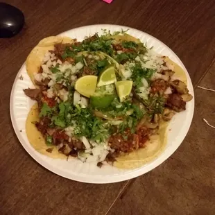 Lengua, tripas, and cabeza tacos.  From the outside taco stand on the weekend nights. Mucho deliciouso. Uno mas por favor!
