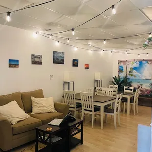 a living room with a couch, table, and chairs