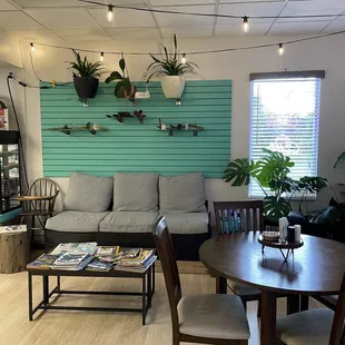 Couch and magazines greet you as you enter