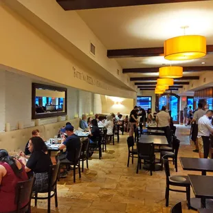 people eating at tables in a restaurant