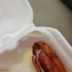 Melted corner of container. Melted styrofoam releases a carcinogen that can get into the food!