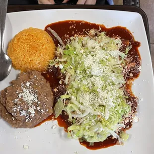 Red enchiladas beans, and rice