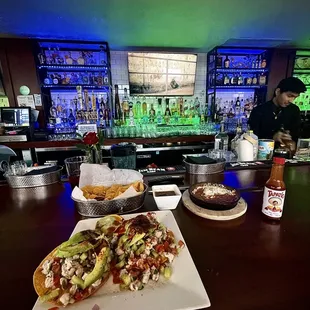 two plates of food on a bar