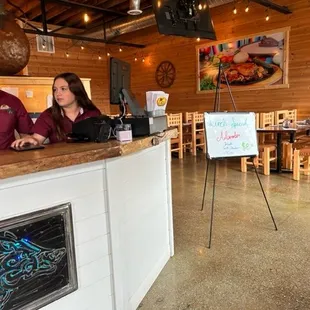 a man and a woman sitting at a bar