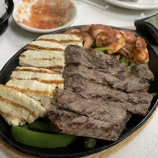 Steak, chicken, and shrimp fajitas.