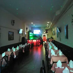 a long dining room with tables and chairs