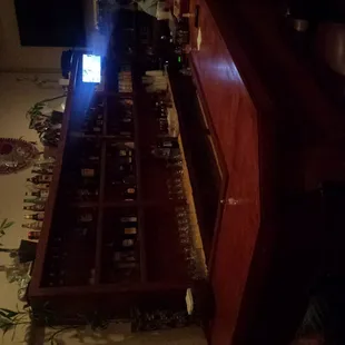 a bar with bottles of wine