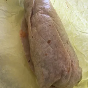 a burrito wrapped in paper