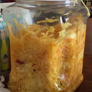 Big jar of curtido(slaw) to go with the pupusas we ordered!