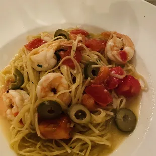 Homemade spaghetti with shrimp, olives, tomatoes in oil truffle