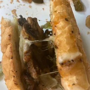 a half eaten sandwich on a plate