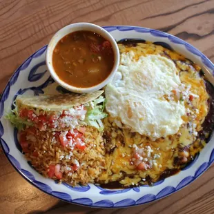 Cheese enchiladas with a fried egg