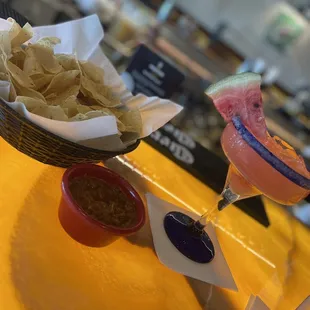 Fresh chips and salsa and watermelon margarita.