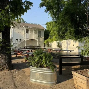 Extra seating out back next to the parking lot.