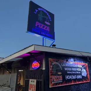 the neon sign for the restaurant