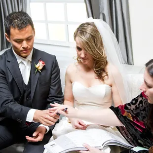 LA Wedding Woman, Elysia Skye, signing the marriage license with Jennifer and Sung at the Roosevelt Hotel.
