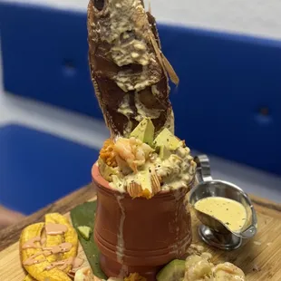 Ultra red snapper Mofongo filled with arroz Mamposteo shrimp in thick garlic sauce