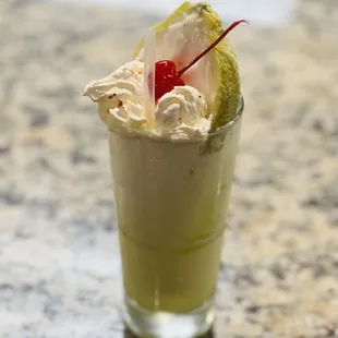 a drink in a tall glass