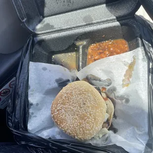 Brisket Sandwich with the slaw, sauce and pickles with small side of beans. Very good!