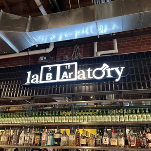 a bar with bottles of alcohol