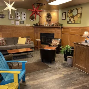 brightly colored chairs and a fireplace