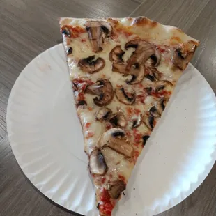 Mushroom pizza slice.