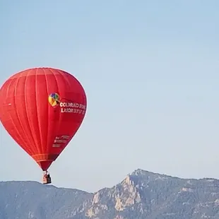 The Colorado Springs Labor Day Lift Off Balloon with Pike's Peak in the background.
