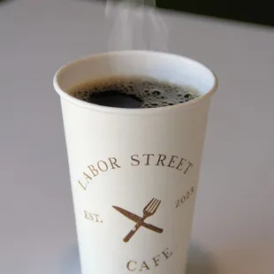 a steaming cup of coffee