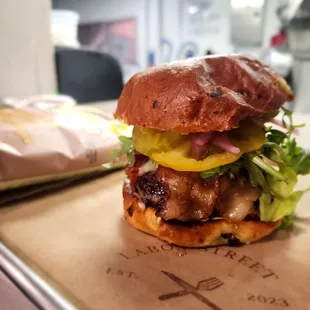 a burger with lettuce and pickles