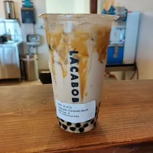 a cup of iced coffee on a table