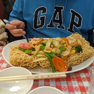 the massive crispy egg noodles with seafood. at least 2, if not 3 portions of food.