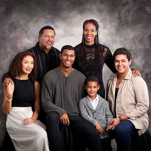 Lacey Wolf can capture elegant portraits of your whole family in our classic studio setting.