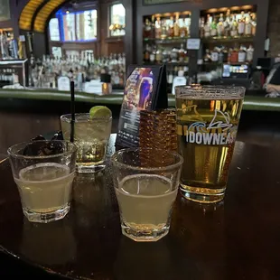 four glasses of alcohol on a table